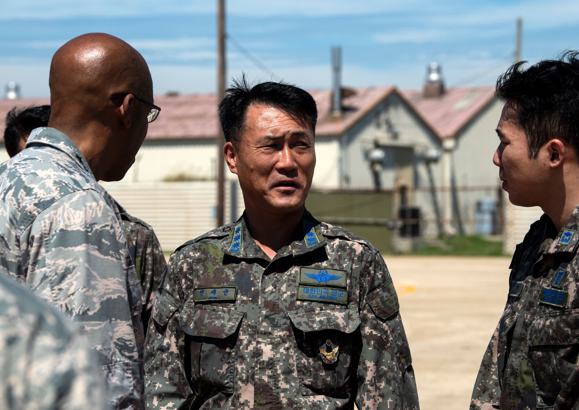 U.S. Air Force Gen. CQ Brown, Jr., Pacific Air Forces commander, converses with leadership from the Republic of Korea Air Force’s 38th Fighter Group during his visit to Kunsan Air Base, Republic of Korea, Aug. 29, 2018. Brown spoke highly of the continued U.S.-ROKAF relationship during his visit to the base. (U.S. Air Force photo by Senior Airman Stefan Alvarez)