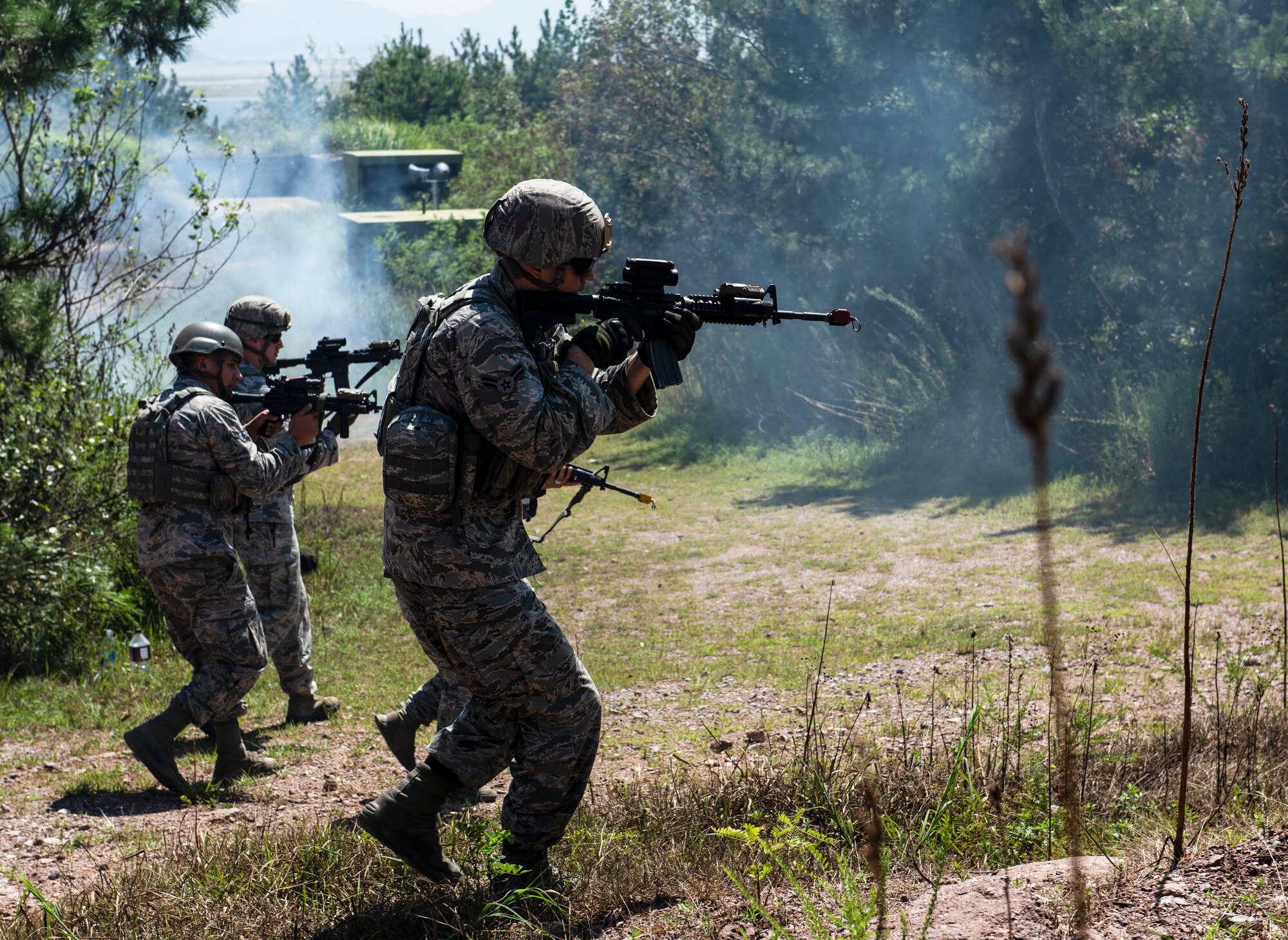 8th Security Forces Squadron Airmen conduct a sweep for simulated opposing forces during an immersion tour for Gen. CQ Brown, Jr., Pacific Air Forces commander, at Kunsan Air Base, Republic of Korea, Aug. 29, 2018. Security forces’ primary mission includes defending the base and its assets. (U.S. Air Force photo by Senior Airman Stefan Alvarez)