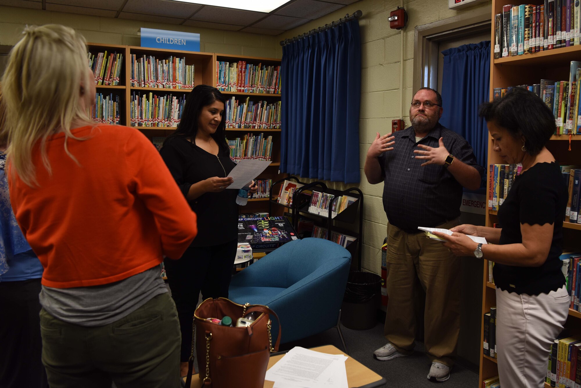 John Crawford, 8th Fighter Wing librarian, briefs Sharene Brown, wife of Gen. CQ Brown, Jr., Pacific Air Forces (PACAF) commander, and Stephanie Johnson, spouse of Chief Master Sgt. Anthony Johnson, PACAF command chief, on the history of the Rosenblum Memorial Library at Kunsan AB, Republic of Korea, August 29, 2018. The Rosenblum Memorial Library’s mission is to aid in the personal and professional development of service men and women at Kunsan AB by providing a wide range of valuable resources and materials to help them successfully meet their goals. (U.S. Air Force photo by Staff Sgt. Jasmonet D. Jackson)