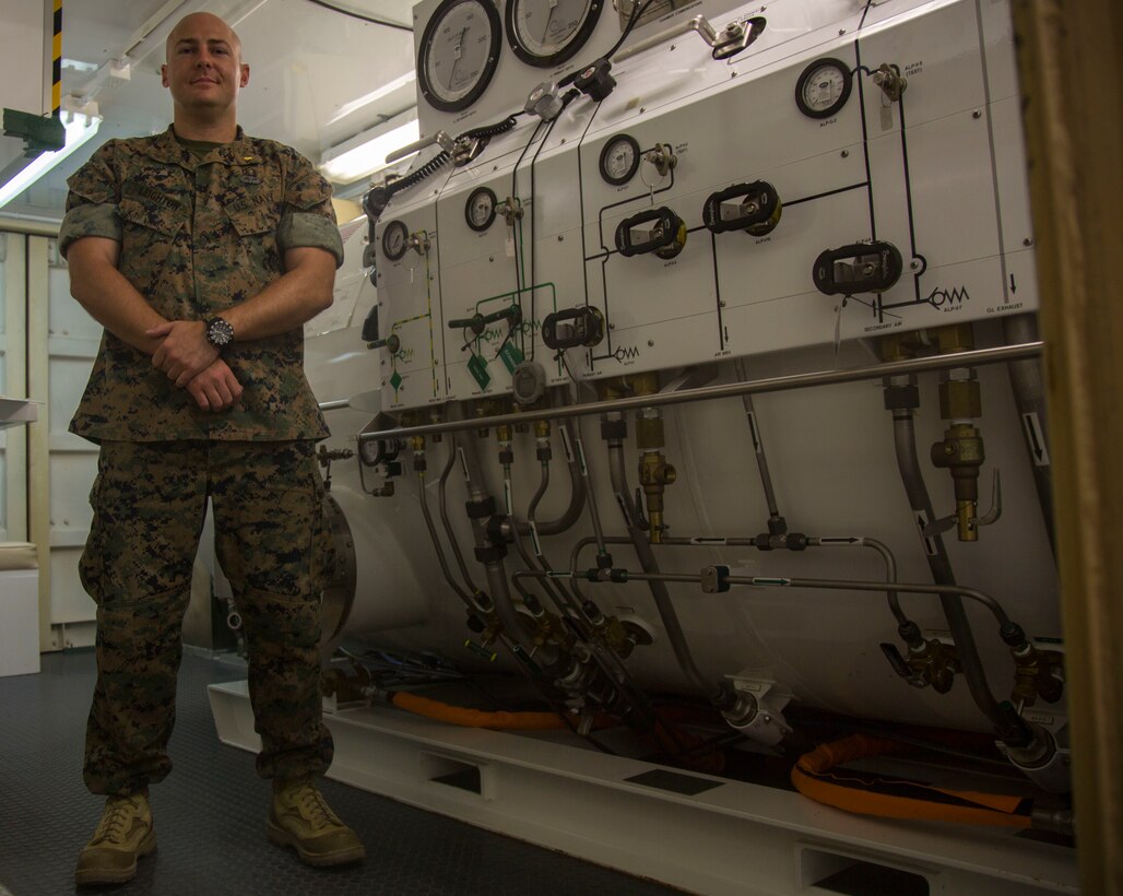 U.S. Navy Lt. Terrance Leighton, a diving medical officer with 3rd Reconnaissance Battalion, 3rd Marine Division, explains the basic operations of the compression chamber on Camp Schwab, Okinawa, Japan on June 13, 2018. The compression chamber is used to help treat service members with water pressure injures. Becoming a diving medical officer requires on average nine years of pipeline training before a candidate is ready to operate in the fleet. Leighton is a native of Boise, Idaho and an alumni of Michigan State University. (U.S. Marine Corps photo by Lance Cpl. Cameron Parks)