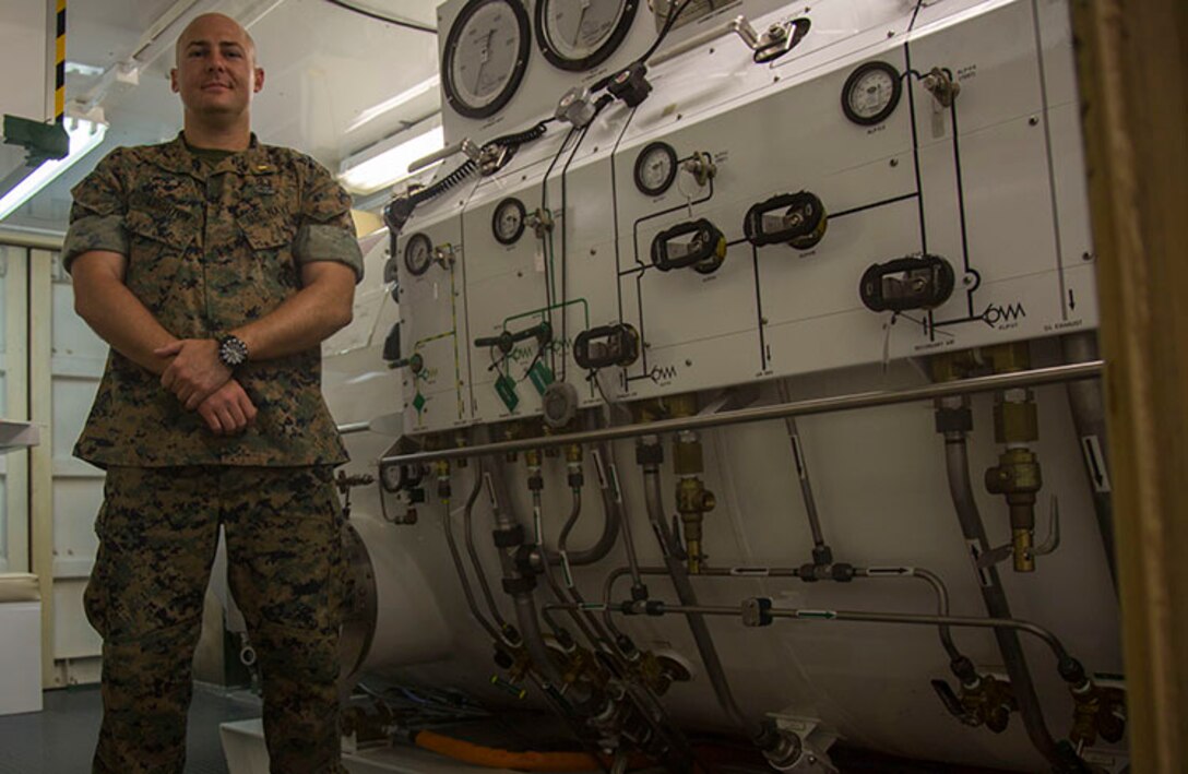 U.S. Navy Lt. Terrance Leighton, a diving medical officer with 3rd Reconnaissance Battalion, 3rd Marine Division, explains the basic operations of the compression chamber on Camp Schwab, Okinawa, Japan on June 13, 2018. The compression chamber is used to help treat service members with water pressure injures. Becoming a diving medical officer requires on average nine years of pipeline training before a candidate is ready to operate in the fleet. Leighton is a native of Boise, Idaho and an alumni of Michigan State University. (U.S. Marine Corps photo by Lance Cpl. Cameron Parks)
