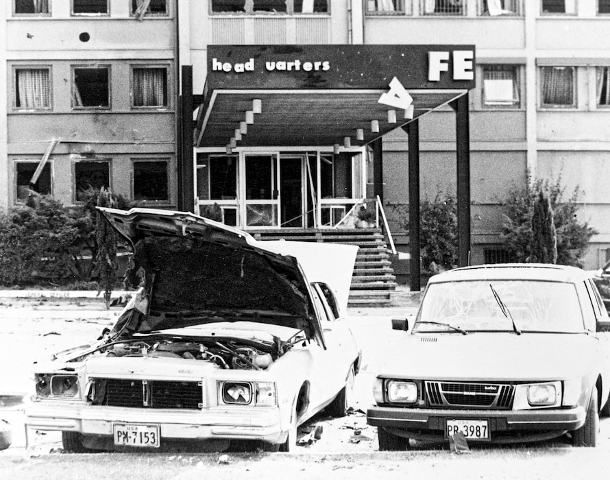 Blown out windows, damaged cars and the torn up entrance to the U.S. Air Force Europe headquarters, as well as damaged cars, the result of a bombing at Ramstein Air Base by the Red Army terrorist group, August 31, 1981. Air Force dentists treated 15 people wounded in the attack. (U.S. Air Force photo)