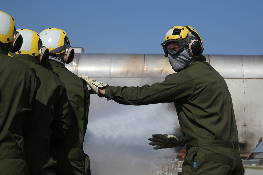 Marines conduct shipboard firefighting drills in Cherry Point, North Carolina to prepare for upcoming deployment.