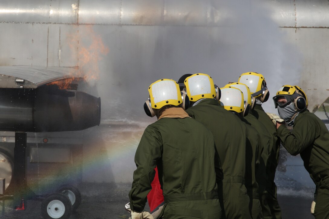 Marines conduct shipboard firefighting drills in Cherry Point, North Carolina to prepare for upcoming deployment.