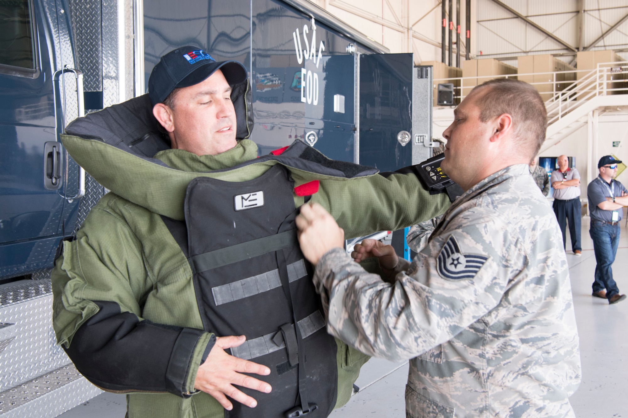 Tech. Sgt. Justin Krautkremer, 434th Civil Engineer Squadron explosive ordnance disposal technician, puts a bomb suit on Jeff Harris, a civilian employer, during a tour at Grissom Air Reserve Base, Ind., Aug. 23, 2018. Airmen from the 434th Air Refueling Wing at Grissom teamed up with those from the 122nd Fighter Wing in Fort Wayne, Ind., the 181st intelligence Wing in Terre Haute, Ind., and the Indiana Employer Support of the Guard and Reserve to host a two-day tour and orientation flight. (U.S. Air Force photo/Tech. Sgt. Benjamin Mota)