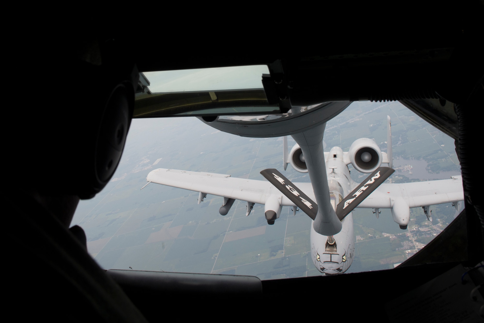 A 72nd Air Refueling Squadron inflight refueling technician, refuels an A-10 Warthog from the 122nd Fighter Wing, Fort Wayne, Ind., over the Midwest Aug. 24, 2018. More than 60 people, nominated by Guard and Reserve members from the 434th ARW, the 122th Fighter Wing in Fort Wayne, Ind., and the 181st Intelligence Wing in Terre Haute Ind., had a hands-on tour of the base that concluded with an air refueling mission. (U.S. Air Force Photo/Staff Sgt. Christopher Massey)