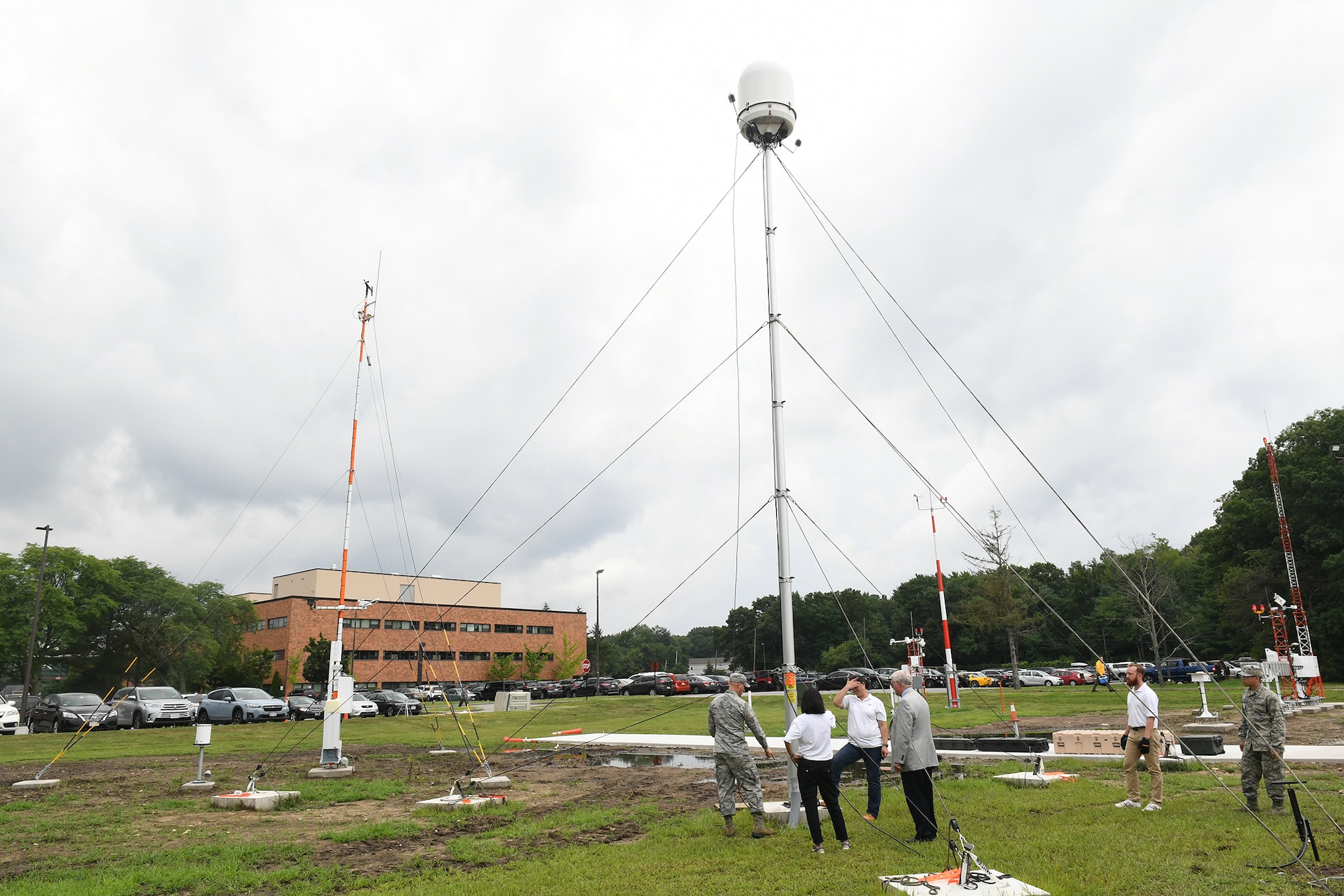 Airmen, civilians and contractors set up the Hanscom Air Force Base, Mass. weather engineering facility Aug. 14. The WEF will give Hanscom’s weather engineers the ability to test, sustain and upgrade equipment used by military installations throughout the world to track and forecast weather. (U.S. Air Force photo by Todd Maki)