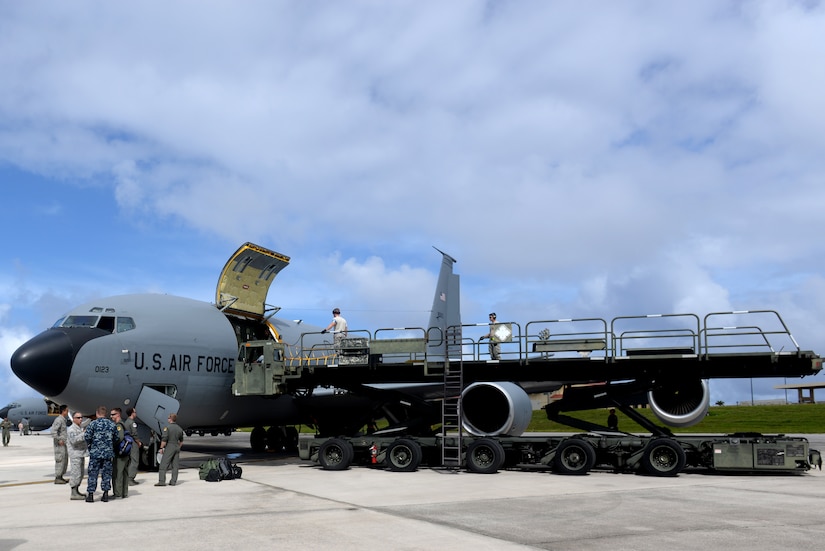Airmen unload cargo from an Air Force KC-135 Stratotanker.