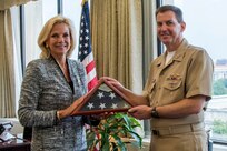 Lisa E. Gordon-Hagerty, the under secretary for Nuclear Security of the U.S. Department of Energy and administrator of the National Nuclear Security Administration (NNSA), presents U.S. Navy Vice Adm. David Kriete, the deputy commander of U.S. Strategic Command, with a U.S. flag that has been flown over every NNSA lab, plant, and site during an award ceremony at NNSA headquarters in Washington, D.C., Aug. 17, 2018.  Kriete also received the Administrator’s Distinguished Service Silver award for his exceptional service as the Director of Strategic Capabilities Policy at the National Security Council from July 2016 to March 2018.