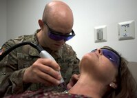 U.S. Army Capt. Jonathan Jeter, 59th Medical Wing dermatology resident, conducts a pulse dye laser treatment on a patient at the Wilford Hall Ambulatory Surgical Center at Joint Base San Antonio-Lackland. The PDL is used to reduce skin blemishes and scars. The dermatology clinic provides care to approximately 33,000 patients a year.