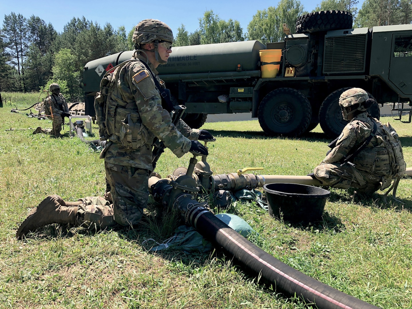 Soldiers with the 240th Composite Supply Company monitor a fuel pump pushing DLA-managed gas in Drawsko Pomorskie, Poland, during Saber Strike 2018. DLA supported the U.S. Army Europe-led exercise in Estonia, Latvia, Lithuania and Poland.