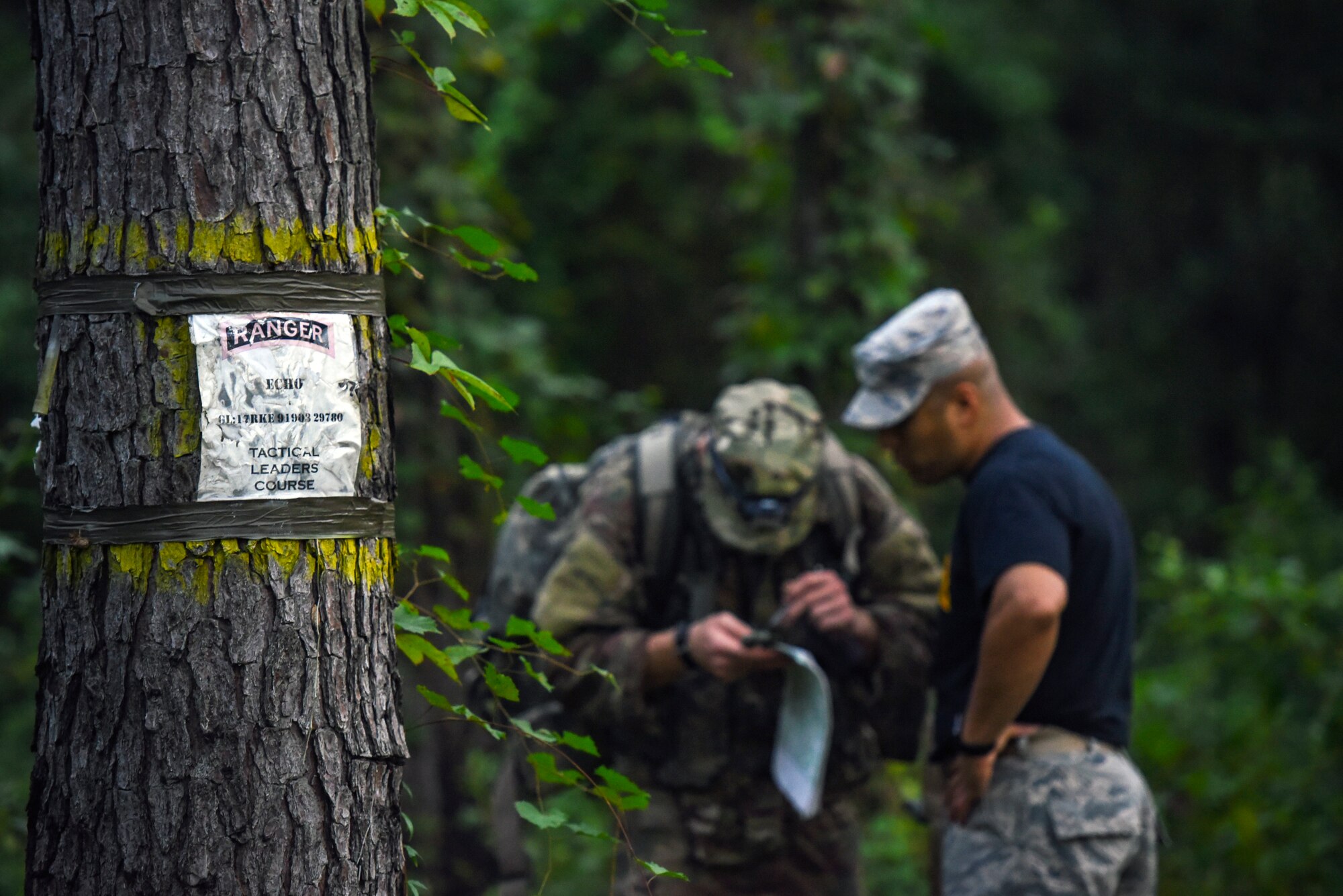Senior Master Sgt. Dzajic Martinez, Pre-Ranger Assessment Course (Pre-RAC) instructor, right, reviews an Airmen’s land navigation coordinates during a Pre-RAC, Aug. 25, 2018, at Moody Air Force Base, Ga. Moody’s 93d Air Ground Operations Wing hosted the three-day assessment which challenged approximately 20 Airmen from the 93d AGOW and 23d Wing on their physical fitness, land navigation skills, leadership qualities, water confidence and academic and tactical abilities under duress. The evaluation is designed to determine whether Airmen are ready to attend the Air Force Ranger Assessment Course held at Fort Bliss, Texas. (U.S. Air Force photo by Senior Airman Greg Nash)