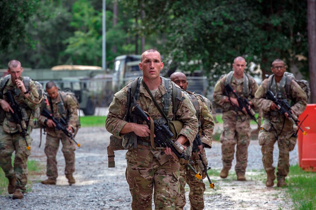 Airmen advance through a simulated battlefield during a Pre-Ranger Assessment Course, Aug. 26, 2018, at Moody Air Force Base, Ga. Moody’s 93d Air Ground Operations Wing hosted the three-day assessment which challenged approximately 20 Airmen from the 93d AGOW and 23d Wing on their physical fitness, land navigation skills, leadership qualities, water confidence and academic and tactical abilities under duress. The evaluation is designed to determine whether Airmen are ready to attend the Air Force Ranger Assessment Course held at Fort Bliss, Texas. (U.S. Air Force photo by Senior Airman Greg Nash)