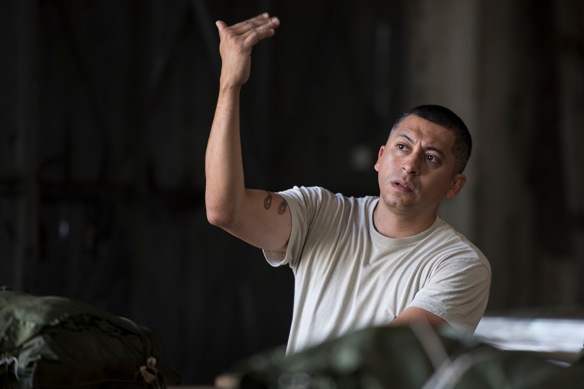 U.S. Air Force Staff Sgt. Julio Pernas, 86th Logistics Readiness Squadron aerial delivery supervisor, directs a forklift as it picks up a container delivery system at Otopeni Air Base, Romania, Aug. 22, 2018. The CDS bundles were then taken to C-130J Super Hercules aircraft assigned to the 37th Airlift Squadron, Ramstein Air Base, Germany, to be airdropped later that day as part of exercise Carpathian Summer 2018. (U.S. Air Force photo by Senior Airman Devin Boyer)