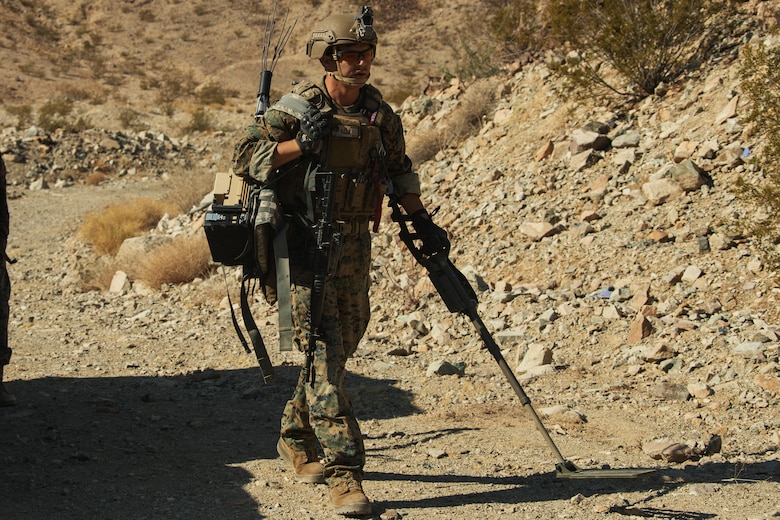 A U.S. Marine Corps Explosive Ordnance Disposal (EOD) student sweeps the response site with his Compact Metal Detector during Improvised Explosive Device training, which was conducted as part of the EOD Supervisors Course at Ranges 110 and 112 aboard the Marine Corps Air Ground Combat Center, Twentynine Palms, Calif. Aug. 17, 2018. The training was conducted with members of the U.S. Air Force for the purpose of helping members of the EOD community sharpen their skills as leaders for real life situations. (U.S. Marine Corps photo by Lance Cpl. Christian E. Moreno)