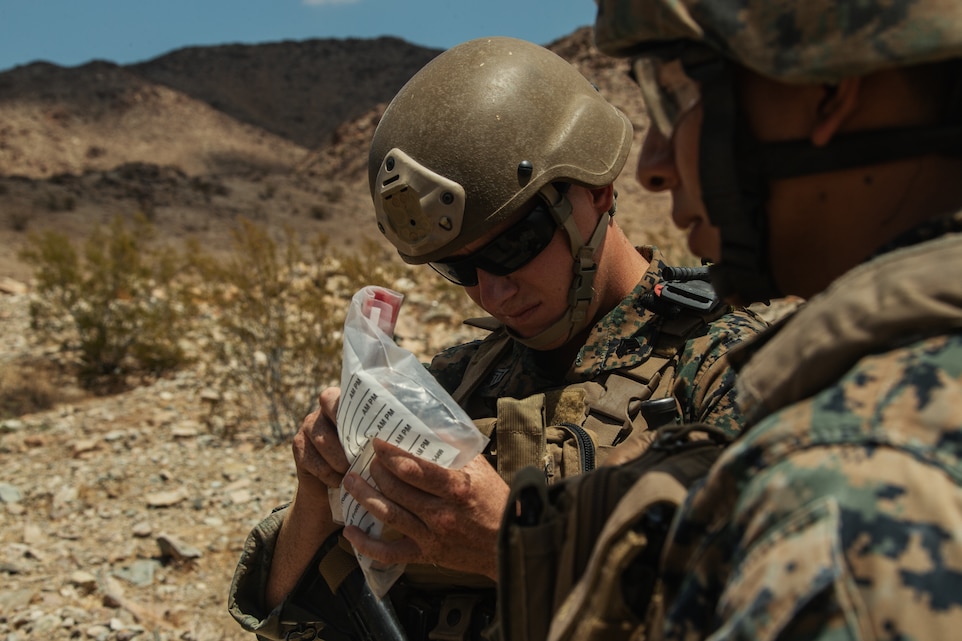 A U.S. Marine Corps Explosive Ordinance Disposal (EOD) student examines samples of the Improvised Explosive Device (IED) his team found during IED training, which was conducted as part of the Supervise EOD Training at Range blah aboard the Marine Corps Air Ground Combat Center, Twentynine Palms, Calif. Aug. 17, 2018. The training was conducted with members of the U.S. Air Force for the purpose of helping members of the EOD community sharpen their skills as leaders for real life situations. (U.S. Marine Corps photo by Lance Cpl. Christian E. Moreno)