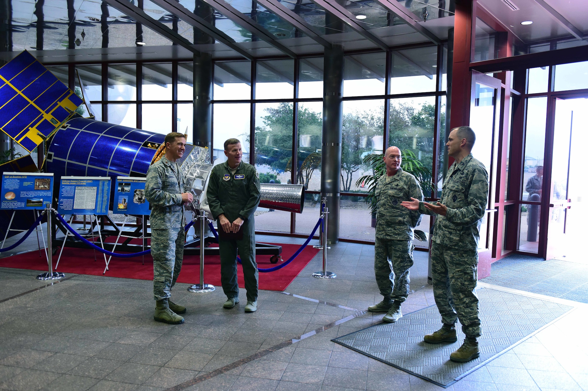 Gen. Tod D. Wolters, U.S. Air Forces in Europe and Air Forces Africa commander, second from left, is greeted by members of Team Buckley in the Mission Control Station lobby at Buckley Air Force Base, Colorado, Aug. 8, 2018.