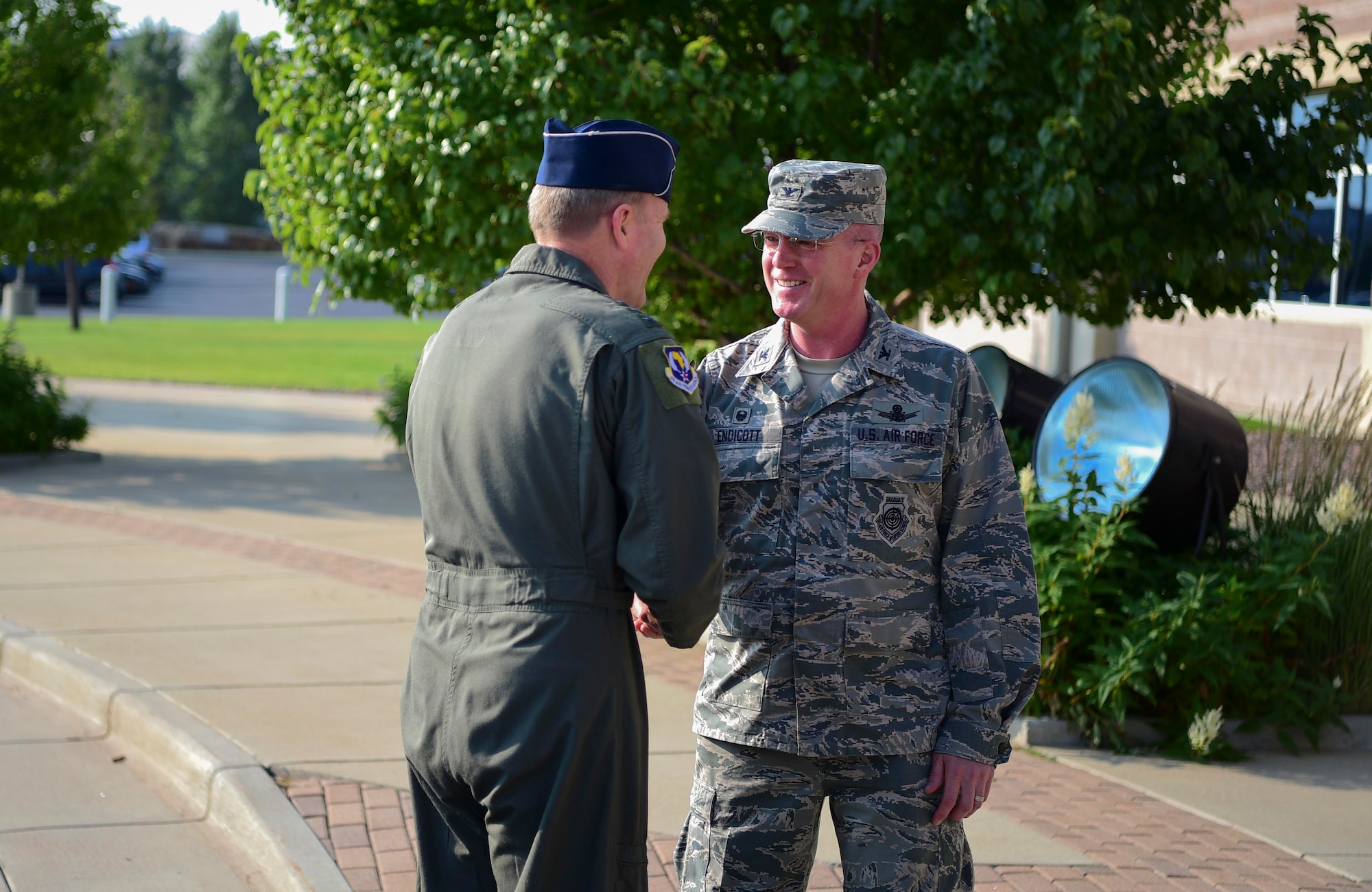 Col. Troy Endicott, 460th Space Wing commander, greets Gen. Tod D. Wolters, U.S. Air Forces in Europe and Air Forces Africa commander, Aug. 8, 2018, on Buckley Air Force Base, Colorado.