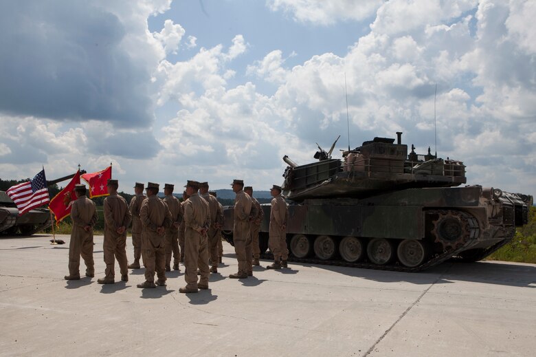 Marine tank gunner crews from 1st, 2nd, and 4th Tank Battalions stand in formation during the 15th annual Tiger Competition ceremony at Wilcox range in Fort Knox, Kentucky, Aug. 28, 2018. The crew from 2nd Tank Bn. was recognized as the competition winner. (U.S. Marine Corps photo by Lance Cpl. Tessa D. Watts)
