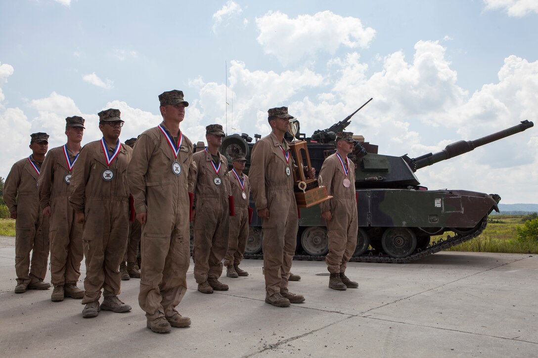 Marine tank gunner crews from 1st, 2nd, and 4th Tank Battalions stand in formation during the 15th annual Tiger Competition ceremony at Wilcox range, Fort Knox, Kentucky, Aug. 28, 2018. The crew from 2nd Tank Bn. was recognized as the competition winner. (U.S. Marine Corps photo by Lance Cpl. Tessa D. Watts)