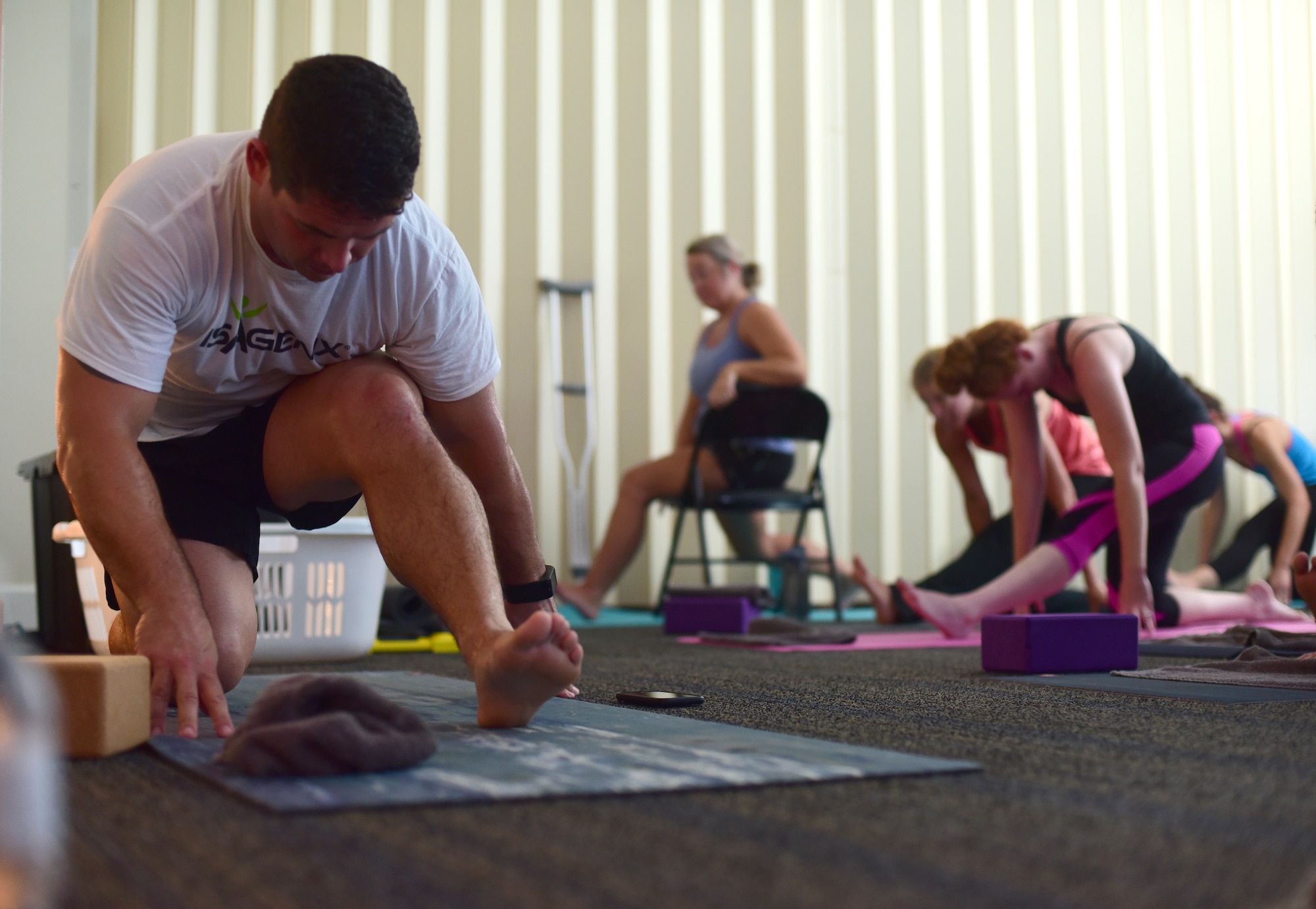 U.S. Air Force Master Sgt. Ramiro Villalobos, Paul W. Airey Noncommissioned Officer Academy instructor, teaches a class at a Tyndall Pacesetters yoga session at the Balfour Beatty Community Center on Tyndall Air Force Base, Florida, Aug. 22, 2018. Villalobos teaches yoga for the group with the goal of providing a positive atmosphere of self-betterment through high-intensity training, yoga and run training. (U.S. Air Force photo by Senior Airman Cody R. Miller)