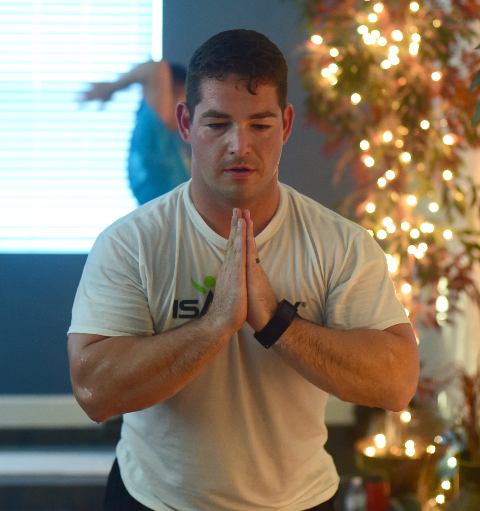 U.S. Air Force Master Sgt. Ramiro Villalobos, Paul W. Airey Noncommissioned Officer Academy instructor, assumes the neutral “prayer” position during a Tyndall Pacesetters yoga class at the Balfour Beatty Community Center on Tyndall Air Force Base, Florida, Aug. 22, 2018. Regular yoga sessions can produce a number of benefits like lessening chronic pain, such as lower back pain, arthritis, headaches and carpal tunnel syndrome. (U.S. Air Force photo by Senior Airman Cody R. Miller)