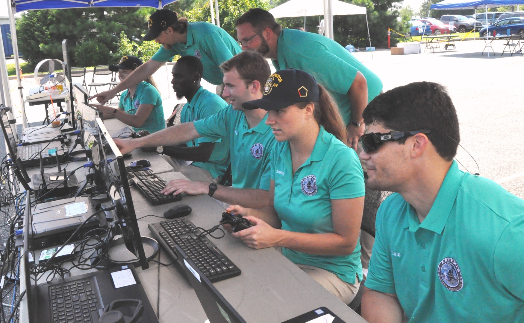 IMAGE: DAHLGREN (Aug. 7, 2018) – The Naval Surface Warfare Center Dahlgren Division (NSWCDD) Sly Fox Mission 23 team in action while demonstrating ARTEMIS - Autonomous Remote Tactical Engagement Multi-Domain Intelligence Swarm – capabilities. Over the past six months, the team used artificial intelligence and machine learning to develop unmanned vehicle swarms that can counteract potential threats of swarming unmanned systems. The Sly Fox program is an NSWCDD Naval Innovative Science and Engineering (NISE) funded rapid prototyping program intended to develop the science and engineering workforce – mostly junior scientists and engineers – while applying their talents to known technology gaps. NISE is part of National Defense Authorization Act Section 219 legislation, allowing warfare centers and research labs to apply money invested in their organizations to research, engineering and technology. NISE efforts have provided breakthrough research and have been responsible for maturation and transition of technology to the warfighter and programs of record.