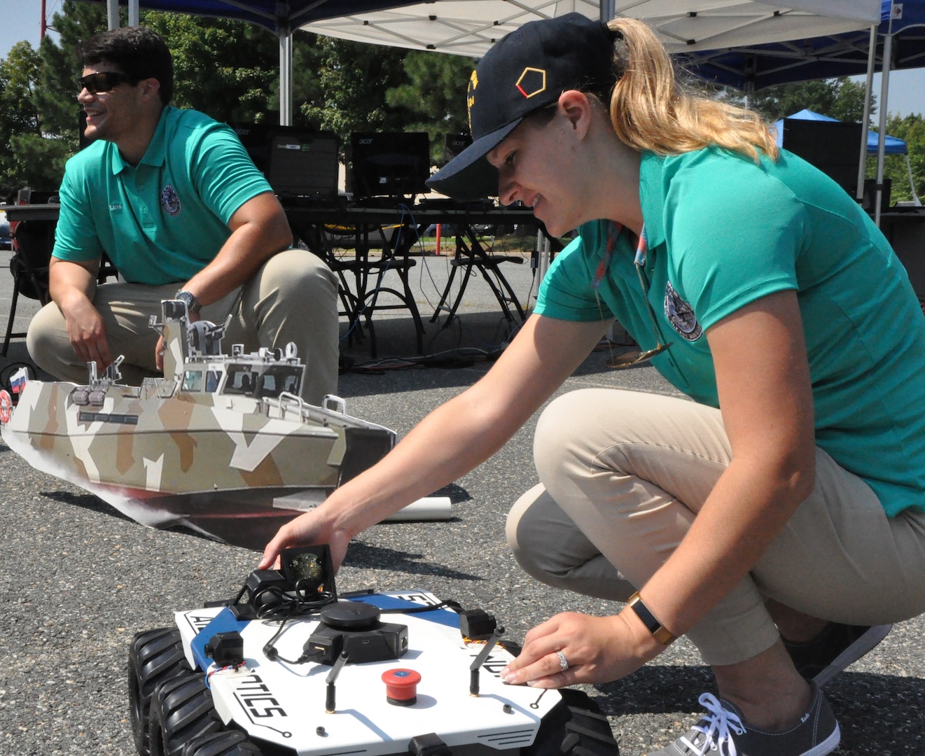 IMAGE: DAHLGREN (Aug. 7, 2018) – The Naval Surface Warfare Center Dahlgren Division (NSWCDD) Sly Fox Mission 23 team in action while demonstrating ARTEMIS - Autonomous Remote Tactical Engagement Multi-Domain Intelligence Swarm – capabilities. Over the past six months, the team used artificial intelligence and machine learning to develop unmanned vehicle swarms that can counteract potential threats of swarming unmanned systems. The Sly Fox program is an NSWCDD Naval Innovative Science and Engineering (NISE) funded rapid prototyping program intended to develop the science and engineering workforce – mostly junior scientists and engineers – while applying their talents to known technology gaps. NISE is part of National Defense Authorization Act Section 219 legislation, allowing warfare centers and research labs to apply money invested in their organizations to research, engineering and technology. NISE efforts have provided breakthrough research and have been responsible for maturation and transition of technology to the warfighter and programs of record.