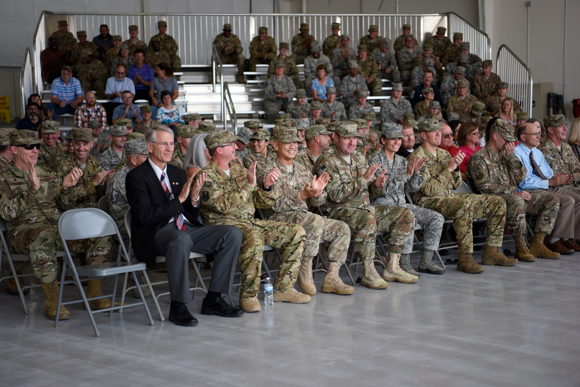 Members of Cannon Air Force Base applaud after a speech at the Daedalian Award Ceremony on August 15 at Cannon Air Force Base, N.M. The Daedalian Award was presented to the 27th Special Operations Logistics Readiness Squadron, adding to their 48 other decorations.