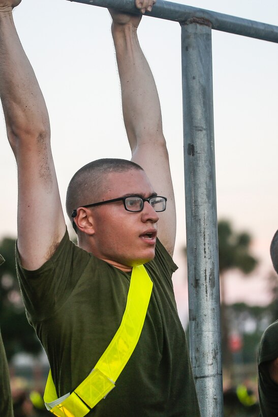Rct. James McMullin, with Echo Company, 2nd Recruit Training Battalion, takes a break between pull-ups during a fast-paced circuit course Aug. 30, 2018, on Marine Corps Recruit Depot Parris Island, S.C. Dynamic courses such as these help prepare recruits for the high standards of the Marine Corps. Recruits endure numerous physical training sessions during their journey to become United States Marines. McMullin, a native of Philadelphia, Penn., is scheduled to graduate with Echo Company Nov. 16, 2018.