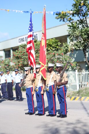 A U.S. Marine color guard carries the colors during a commemoration ceremony Aug. 7, 2018 at Honiara, Guadalcanal, Solomon Islands. U.S. Marines and Sailors with 3rd Marine Logistics Group joined U.S. Coast Guardsmen and the members of the Solomon Island government at the ceremony to commemorate the 76th anniversary of the U.S. Marines and Allied forces landing on the island of Guadalcanal, marking the beginning of the Pacific island-hopping campaign of World War II. (Courtesy Photo)