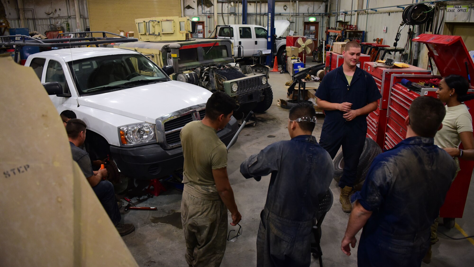 Members of the 386th Expeditionary Logistics Readiness Squadron and U.S. Army Fox Company 227, 1st Attack Reconnaissance Battalion, 227th Aviation Regiment, 1st Air Cavalry Brigade, 1st Cavalry Division, discuss the day’s missions Aug. 14, 2018, at an undisclosed location in Southwest Asia. The 386th ELRS and Fox 227 teams have recently teamed up to complete a number of missions on base. (U.S. Air Force photo by Staff Sgt. Christopher Stoltz)