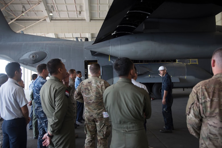 Walter McCracken, 18th Equipment Maintenance Squadron corrosion control contractor, speaks with foreign air force members about corrosion prevention and repair techniques during the 2018 Fighter Logistics and Safety Symposium Aug. 29, 2018, at Kadena Air Base, Japan. Air force officers from Malaysia, Japan, Bangladesh, Sri Lanka, Thailand, Australia, Indonesia and India attended the symposium to boost fighter interoperability within the Pacific region.