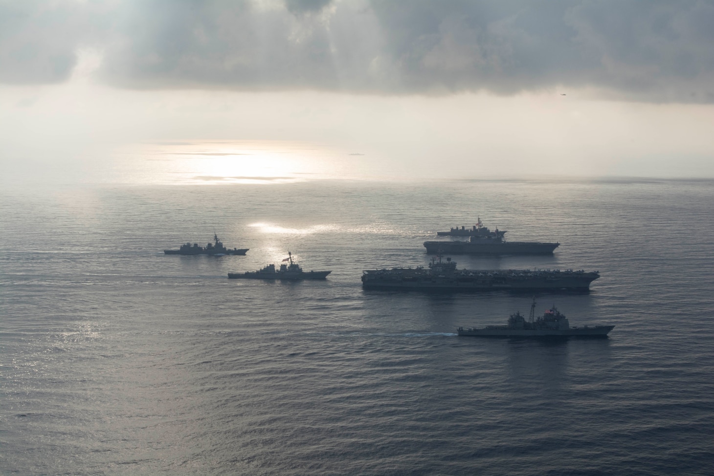 SOUTH CHINA SEA (Aug. 31, 2018) The Ronald Reagan Strike Group ship's aircraft carrier USS Ronald Reagan (CVN 76), the guided-missile destroyer USS Antietam (CG 54) and the guided-missile destroyer USS Milius (DDG 69) conduct a photo exercise with the Japanese Maritime Self-Defense Force ship's the helicopter destroyer JS Kaga (DDH 184), the destroyer JS Inazuma (DD 105) and the destroyer JS Suzutsuki (DD 117). The Ronald Reagan Strike Group is forward-deployed to the U.S. 7th Fleet area of operations in support of security and stability in the Indo-Pacific region.