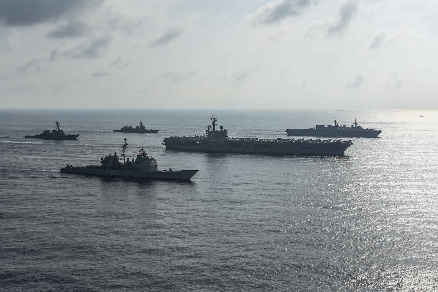 SOUTH CHINA SEA (Aug. 31, 2018) The Ronald Reagan Strike Group ship's aircraft carrier USS Ronald Reagan (CVN 76), the guided-missile destroyer USS Antietam (CG 54) and the guided-missile destroyer USS Milius (DDG 69) conduct a photo exercise with the Japanese Maritime Self-Defense Force ship's the helicopter destroyer JS Kaga (DDH 184), the destroyer JS Inazuma (DD 105) and the destroyer JS Suzutsuki (DD 117). The Ronald Reagan Strike Group is forward-deployed to the U.S. 7th Fleet area of operations in support of security and stability in the Indo-Pacific region.