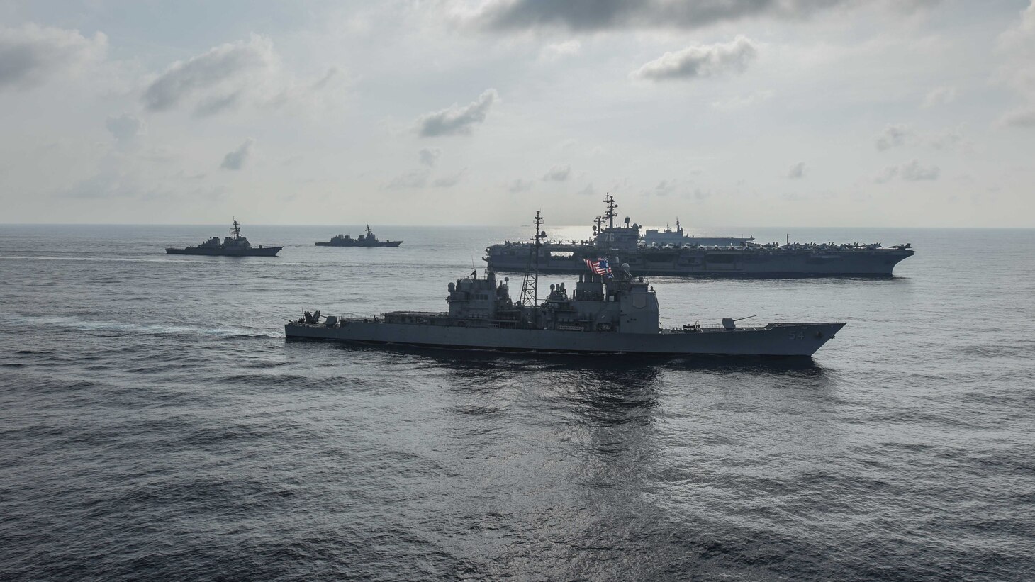 SOUTH CHINA SEA (Aug. 31, 2018) The Ronald Reagan Strike Group ship's aircraft carrier USS Ronald Reagan (CVN 76), the guided-missile destroyer USS Antietam (CG 54) and the guided-missile destroyer USS Milius (DDG 69) conduct a photo exercise with the Japanese Maritime Self-Defense Force ship's the helicopter destroyer JS Kaga (DDH 184), the destroyer JS Inazuma (DD 105) and the destroyer JS Suzutsuki (DD 117). The Ronald Reagan Strike Group is forward-deployed to the U.S. 7th Fleet area of operations in support of security and stability in the Indo-Pacific region.
