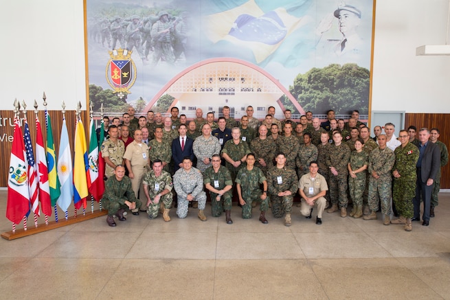 Service members from 10 countries pose for a photo