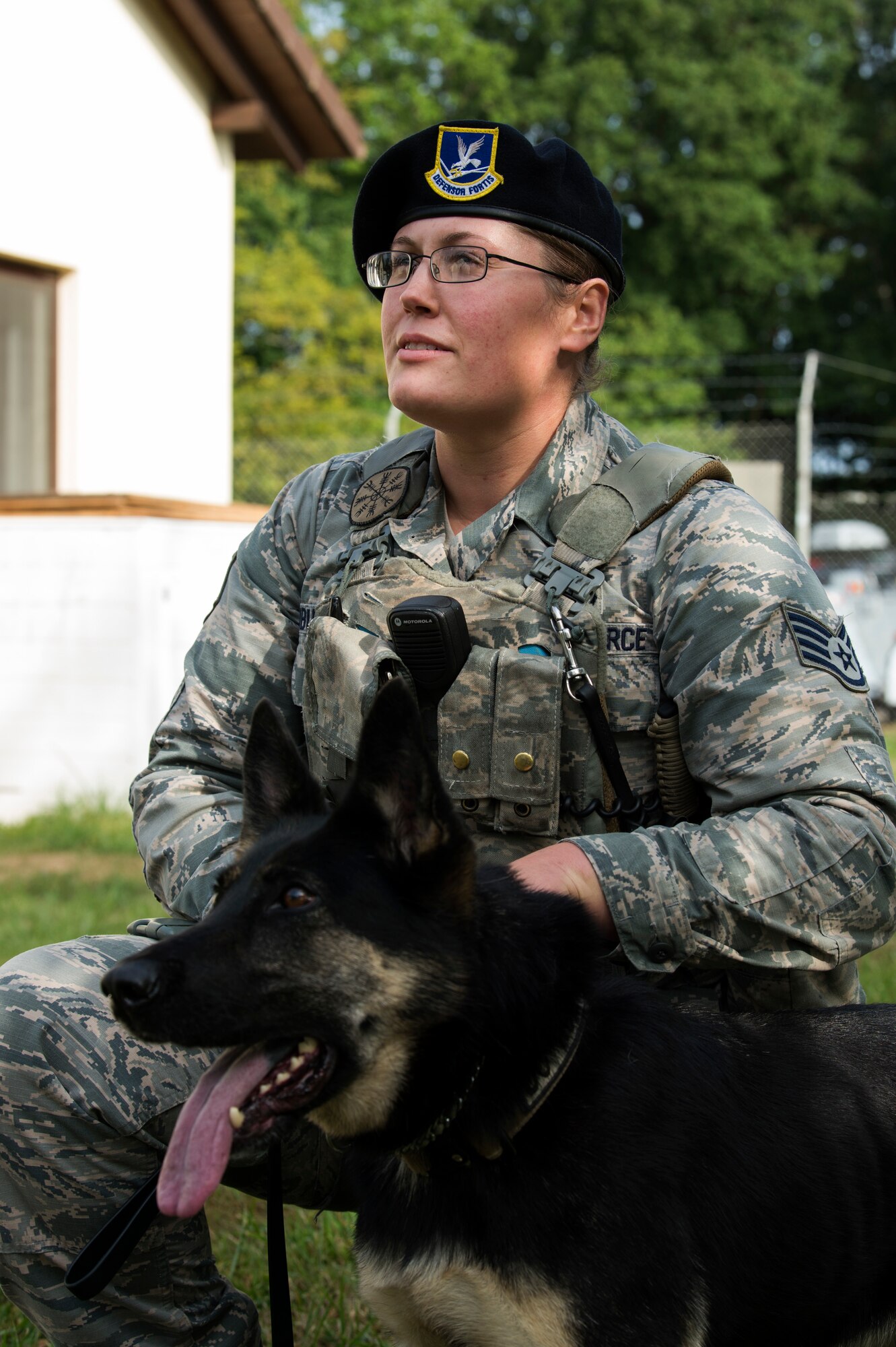 U.S. Air Force Staff Sgt. Adrienne Neuburger, 52nd Security Forces Squadron military working dog handler, lets Tina, a MWD, take a break during training at Spangdahlem Air Base, Germany, Aug. 28, 2018. MWDs are trained to take down suspects while remaining aware their handler is in charge. (U.S. Air Force photo by Airman 1st Class Valerie Seelye)