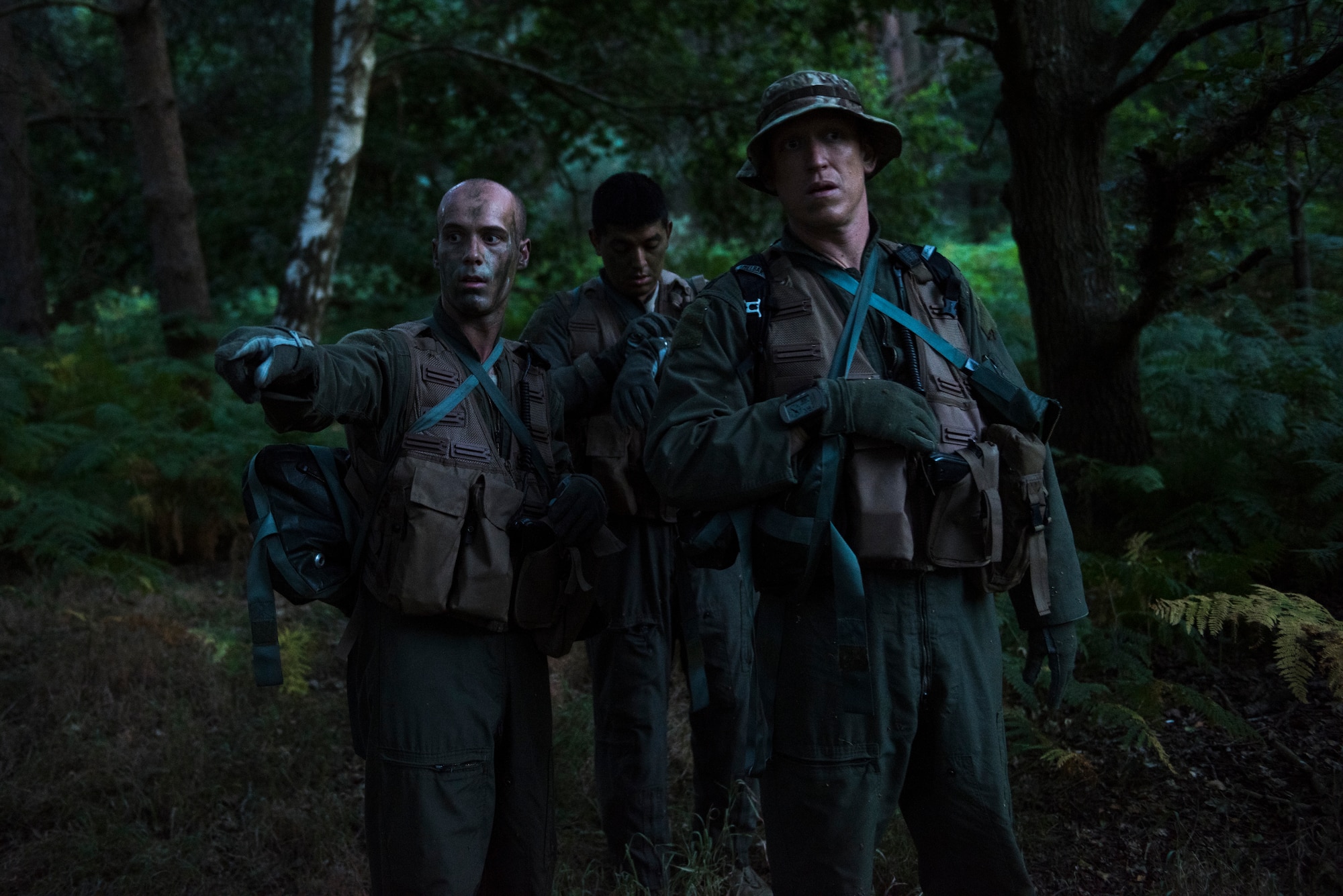 Airmen from the 48th Operations Group determine their next objective during Combat Survival Training Stanford Training Area in Norfolk, England, July 25, 2018. SERE specialists train Airmen on an array of skills needed for survival. The program contains a dozen training courses to include; Local Area Survival, Conduct After Capture, Combat Survival Training, Water Survival Training and Emergency Parachute Training. (U.S. Air Force photo/Senior Airman Malcolm Mayfield)