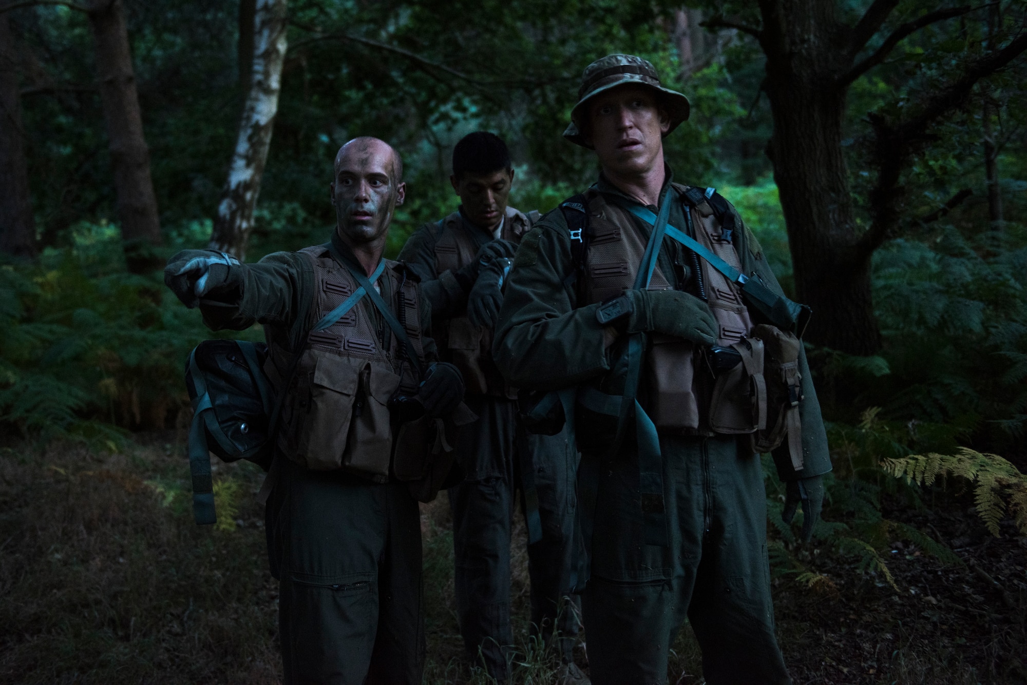 Airmen from the 48th Operations Group determine their next objective during Combat Survival Training Stanford Training Area in Norfolk, England, July 25, 2018. SERE specialists train Airmen on an array of skills needed for survival. The program contains a dozen training courses to include; Local Area Survival, Conduct After Capture, Combat Survival Training, Water Survival Training and Emergency Parachute Training. (U.S. Air Force photo/Senior Airman Malcolm Mayfield)