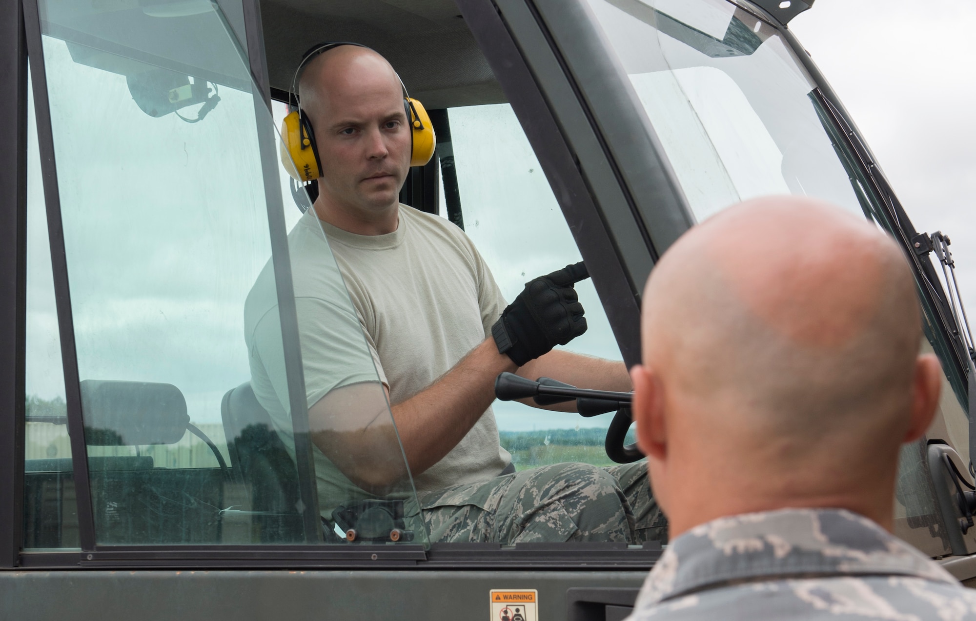 U.S. Air Force Senior Airman William Dunblazier, 420th Munitions Squadron, asks for clarification and guidance at RAF Welford, United Kingdom, Aug. 22, 2018. The unit was prepairing for the squadrons largest munitions retrograde out-shipment in 15 years. (U.S. Air Force photo by Senior Airman Chase Sousa)