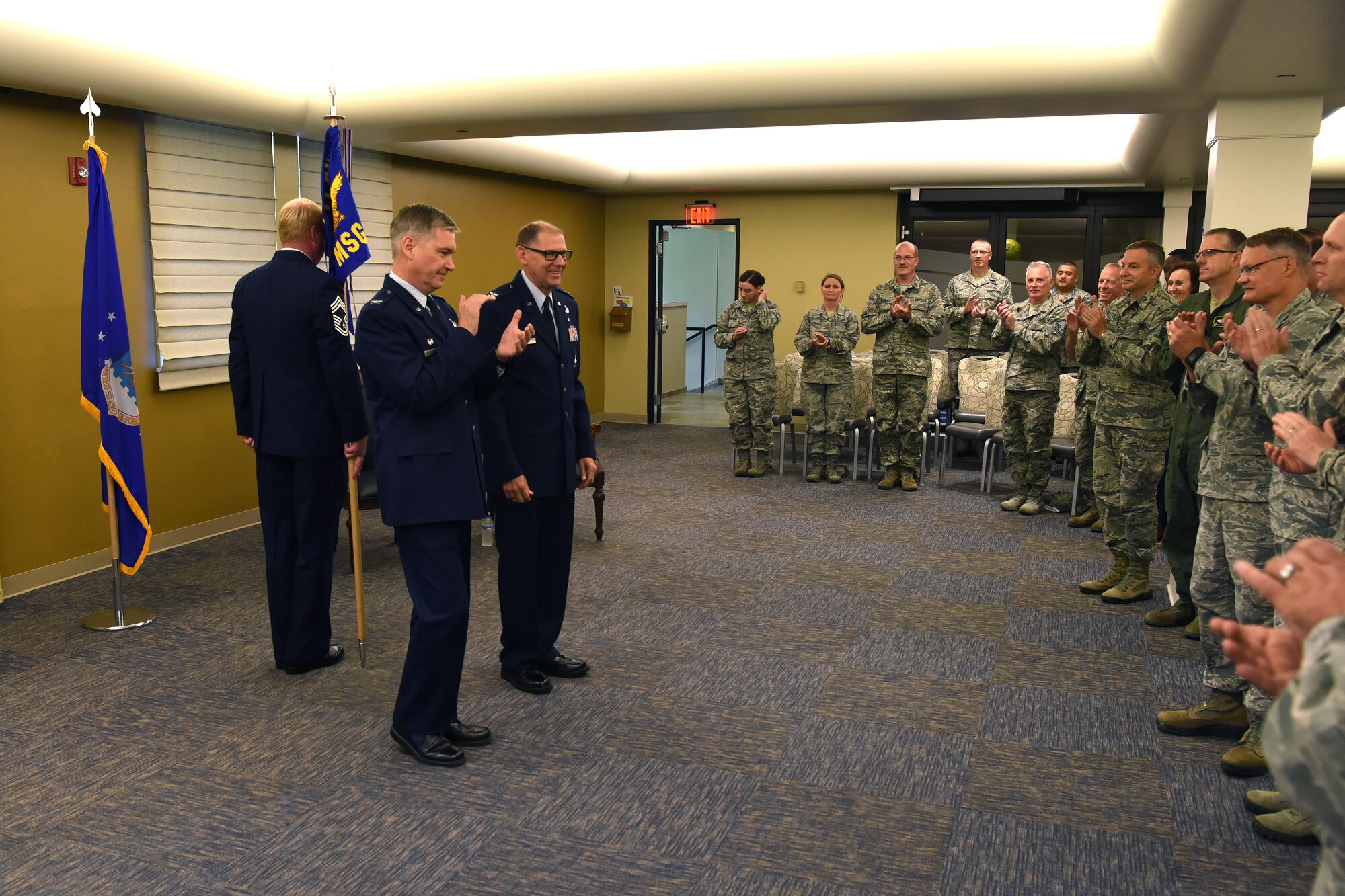 Col. Douglas Strawbridge, commander of the 911th Airlift Wing, leads Airmen of the 911th Mission Support Group in a round of applause during an assumption of command ceremony at the Pittsburgh international Airport Air Reserve Station, Pennsylvania, Aug. 4, 2018. During this ceremony, 911th MSG Airmen welcomed Col. Kenneth M. Lute as their new commander. (U.S. Air Force photo by Staff Sgt. Marjorie A. Bowlden)
