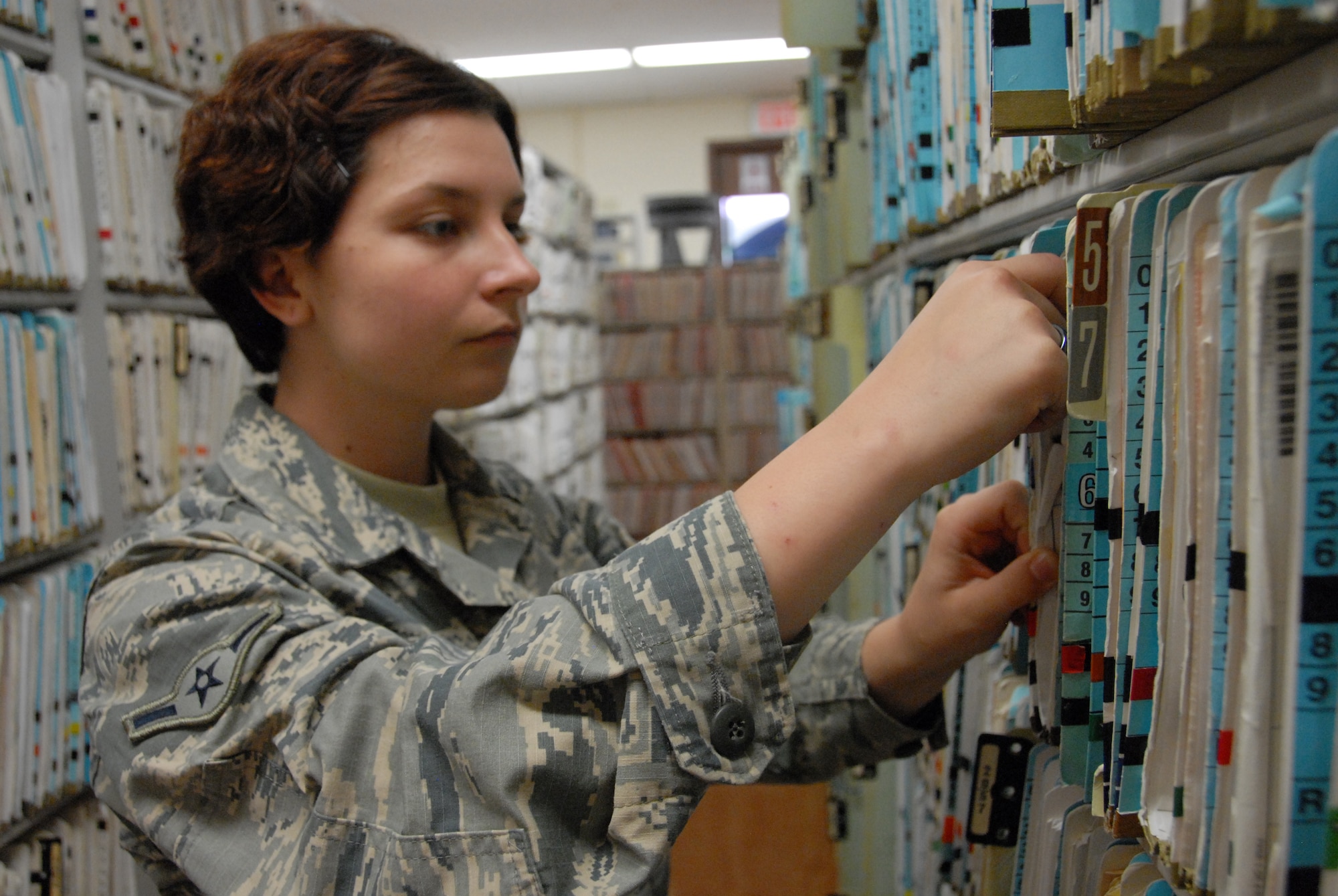 Oregon Air National Guard Airman Alexa Ferris conducts a quality check on patient records in the Outpatient Records section at Tripler Army Medical Center, in Honolulu, Hawaii, Aug. 28, 2018. Ferris and her fellow Airmen from the 142nd Medical Group took part in Medical Facilities Annual Training, Aug. 18-31, 2018, and were able to assist in a real-world support mission when Hurricane Lane threatened to strike the Hawaiian Islands the week of Aug. 20, 2018. (U.S. Air National Guard Photo by Master Sgt. Nick Choy)