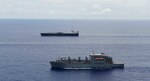 Military Sealift Command ships, vehicle cargo ship USNS Dahl and the dry cargo ship USNS Lewis and Clark, sail in formation in the Pacific Ocean.