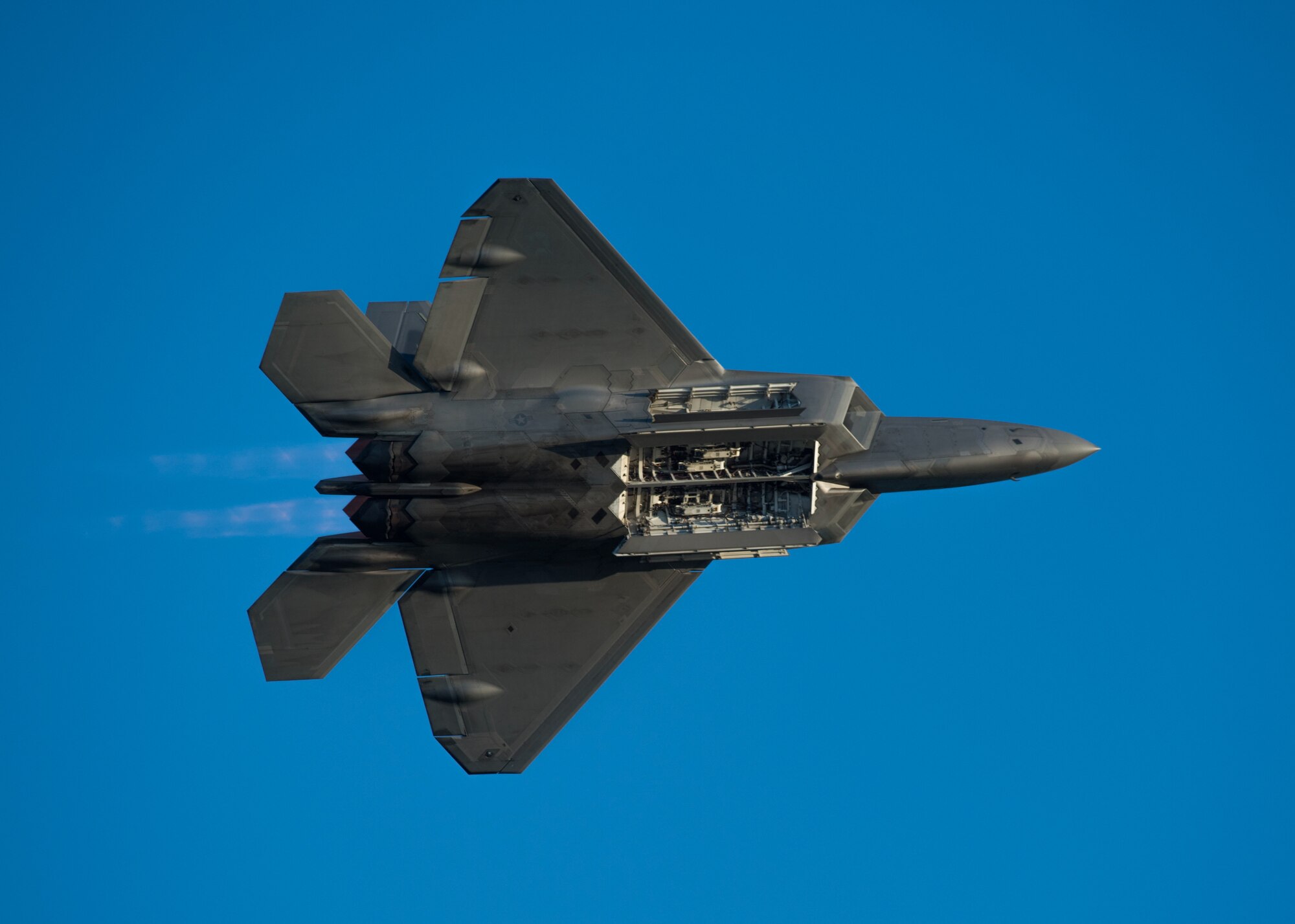 Maj. Paul "Loco" Lopez, F-22 Raptor Demonstration Team pilot, highlights the jet's capabilities at Joint Base Langley-Eustis, Va., Aug. 24, 2018. The Raptor performs a wide range of aerial maneuvers making it the U.S. Air Force's leading fighter aircraft. (U.S. Air Force courtesy photo)