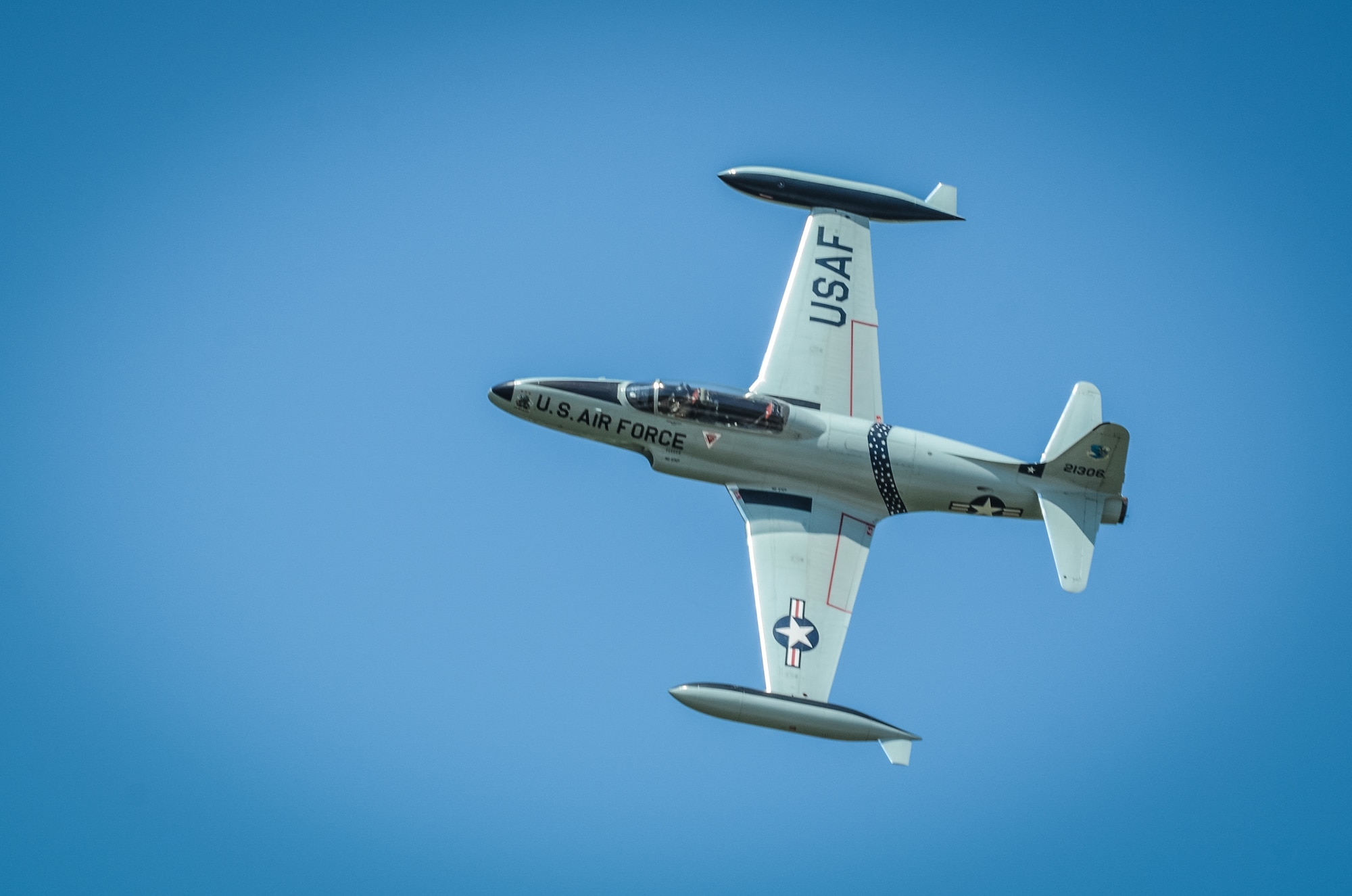 A T-33 Shooting Star aircraft flies overhead during the Sound of Speed Airshow at Rosecrans Air National Guard Base, St. Joseph, Mo., August 26, 2018. The air show was hosted by the 139th Airlift Wing, Missouri Air National Guard and the city of St. Joseph to thank the community for their support. The air show committee estimated 45,000 people attended the Saturday performance. (U.S. Air National Guard photo by Staff Sgt. Patrick Evenson)