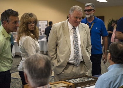 PANAMA CITY, Florida - Naval Surface Warfare Center Panama City Division Technical Director Ed Stewart (SES) and base personnel receive information about cultural artifacts at the 2018 Diversity Day event aboard Naval Support Activity Panama City Aug. 29, 2018. U.S. Navy photo by Eddie Green