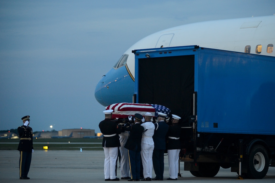 Members of the Joint Service Arrival Team carry the casket of Sen. John McCain at Joint Base Andrews, Md., Aug. 30, 2018. DoD personnel are honoring the former senator, and retired Navy Captain, by providing ceremonial support to his congressional funeral events. (U.S. Air Force photo by Staff Sgt. Kenny Holston)