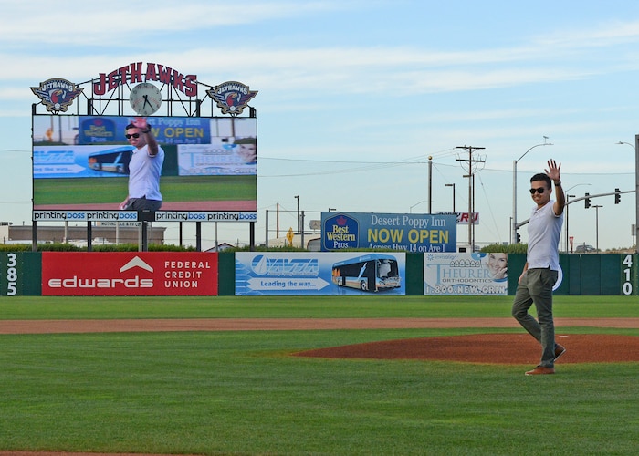 Airman 1st Class Ikraam Khondaker, 412th Communications Squadron, walks in front of the mount before throwing out a ceremonial first pitch before the Lancaster JetHawks game Aug. 30. (U.S. Air Force photo by Kenji Thuloweit)