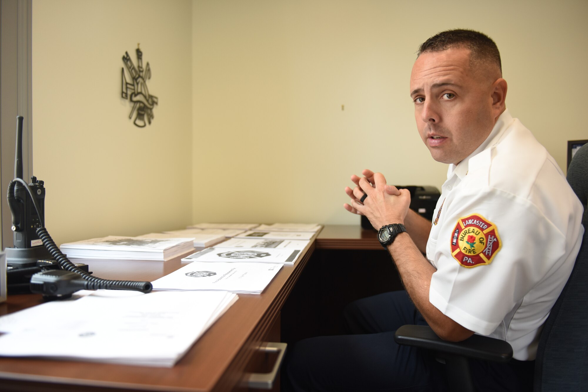 Scott Little, fire chief of Lancaster’s Bureau of Fire, explains various policies and programs that he is working on implementing at the bureau Aug. 21, 2018, Lancaster, Pennsylvania. Little has plans for a number of outreach initiatives, including a citizens’ fire academy, a community engagement program and a youth mentorship program for middle school and high school students. (U.S. Air National Guard photo by Senior Airman Julia Sorber/Released)